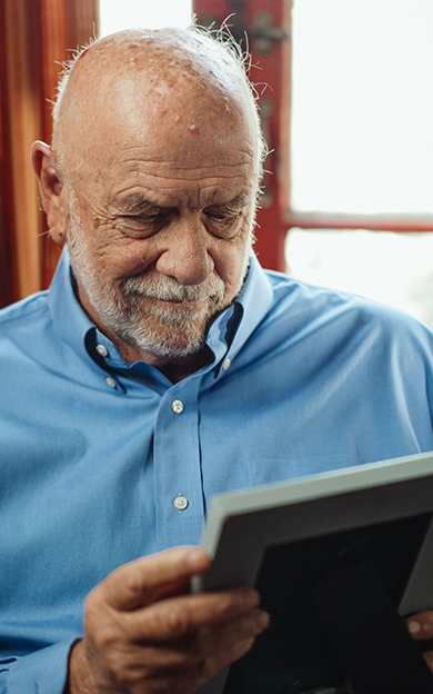resident looking at photo of loved one