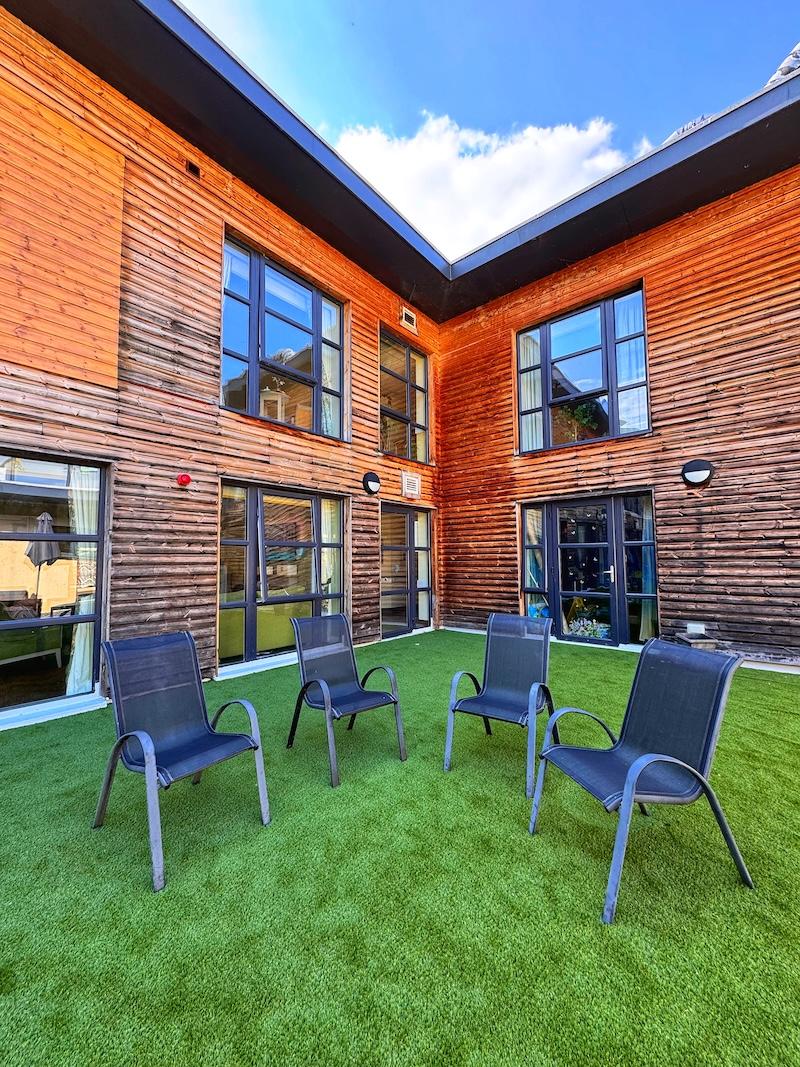 chairs on the grass area in the rooftop garden