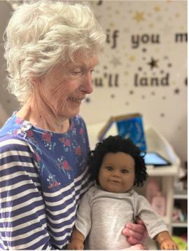 resident with doll