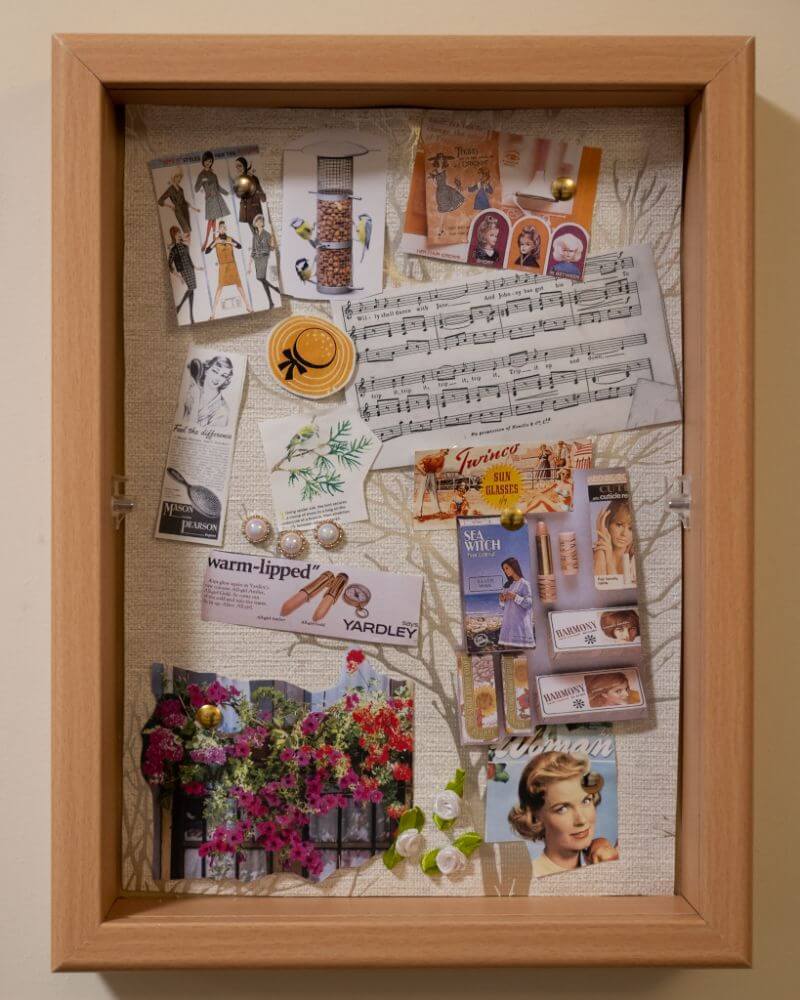 Photo frame with scrapebook style clippings.