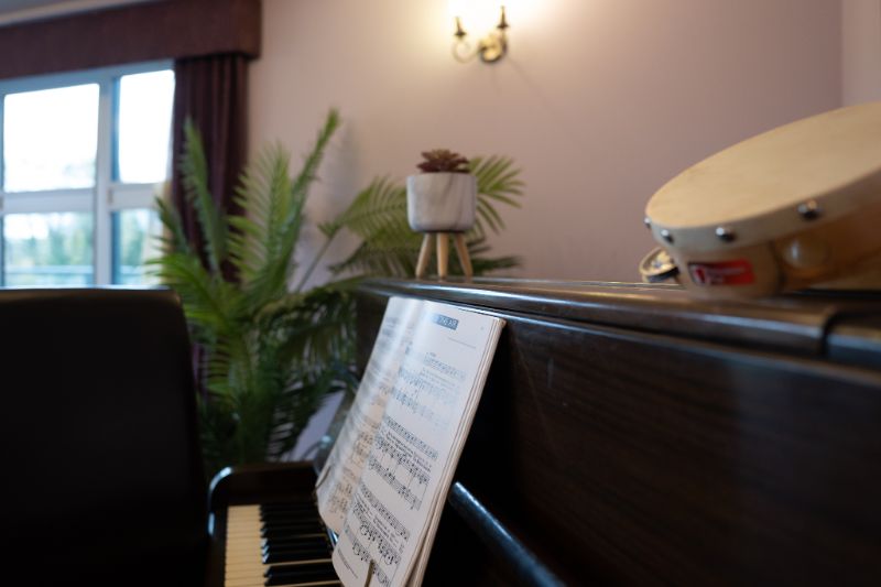 sheet music resting on top of piano