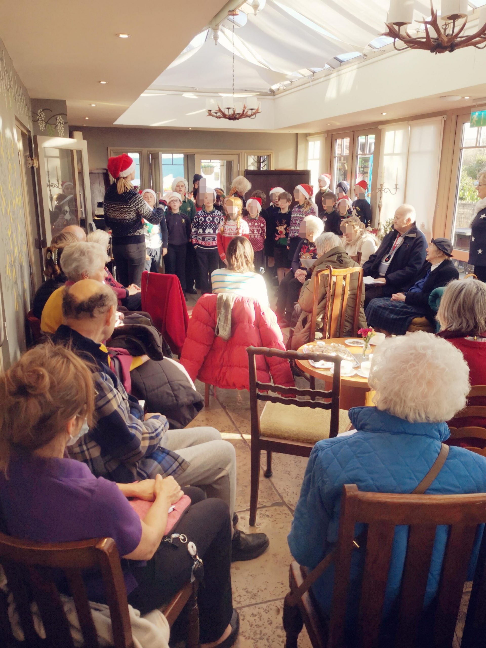 Residents listening to a choir.