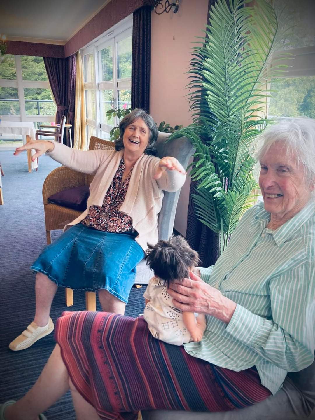 residents sat in armchairs chatting