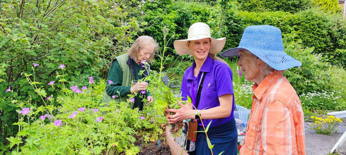 residents doing gardening with carer