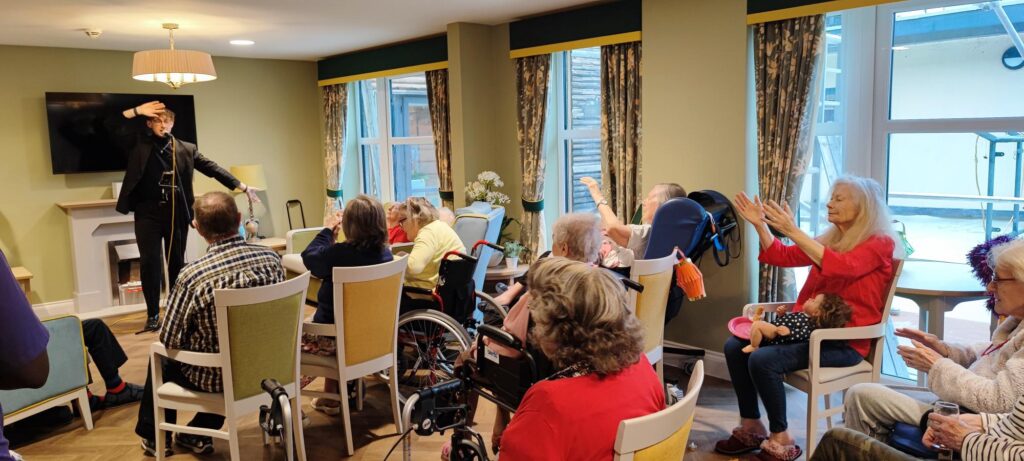 residents singing along to a tribute singer