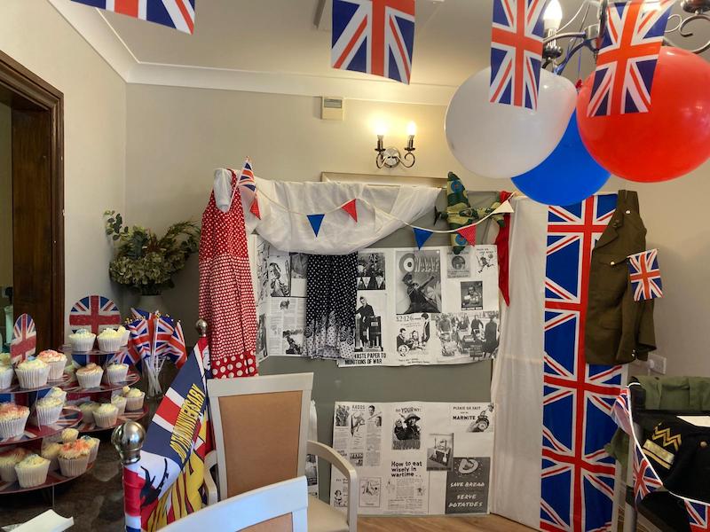 setup with red, white and blue decorations and cupcakes for VE day