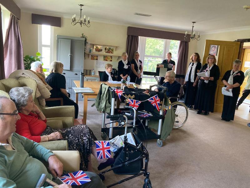 local choir singing to residents in the stourhead unit