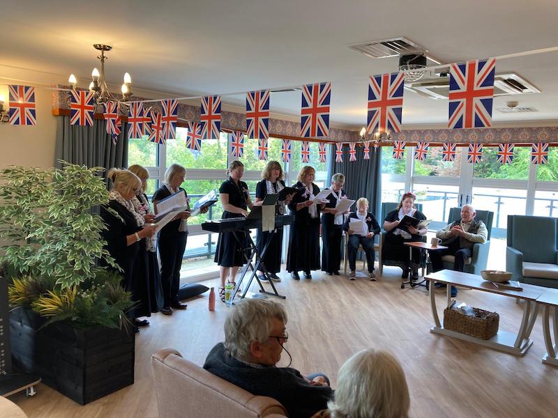 local choir singing to residents in the wylye unit