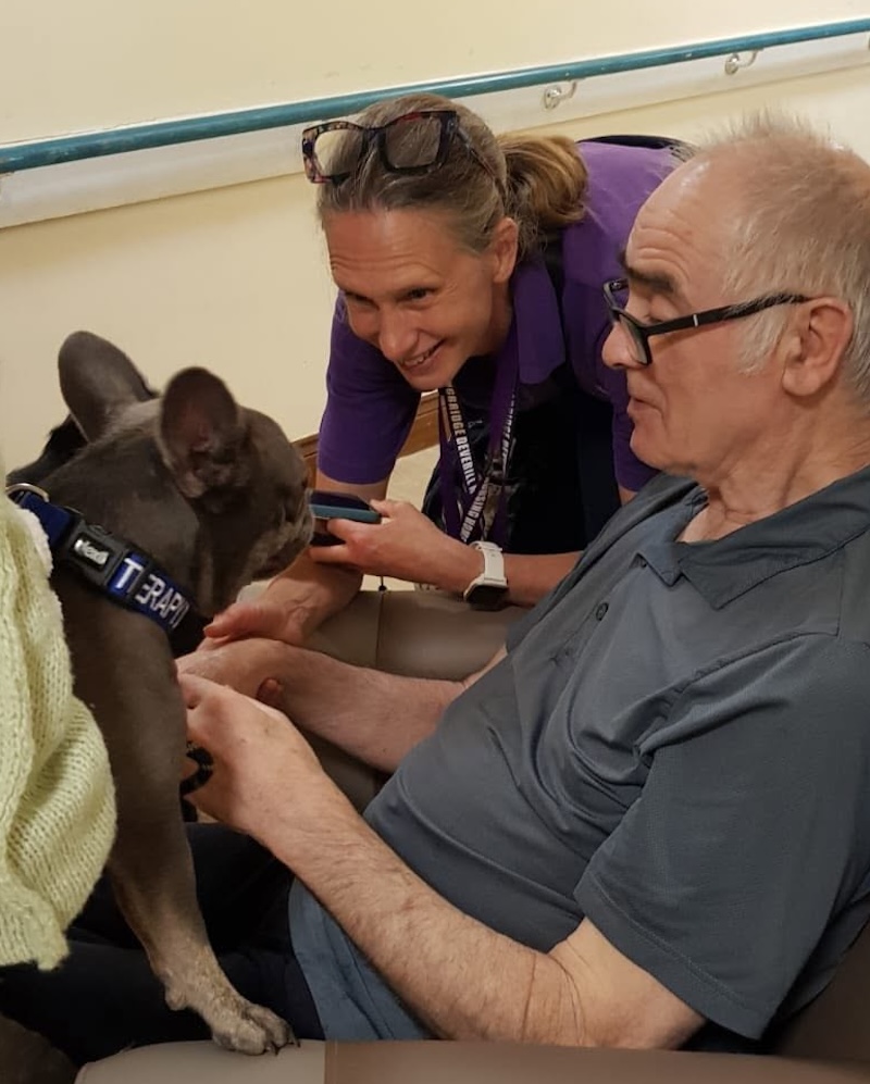 resident with therapy dog