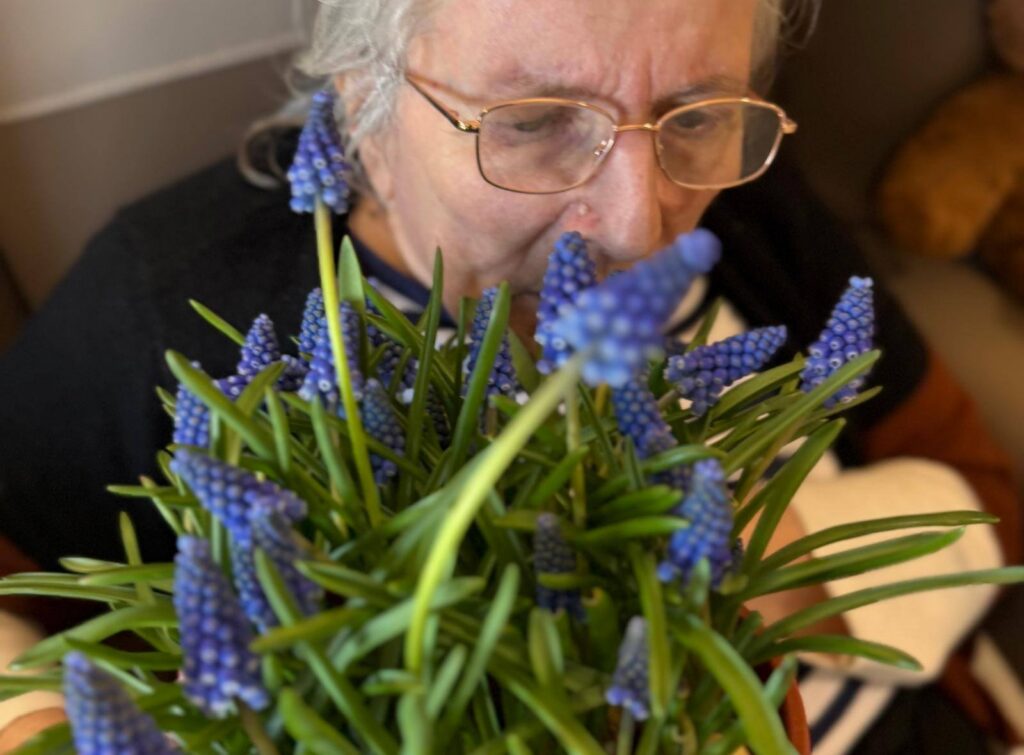 longbridge resident with flowers