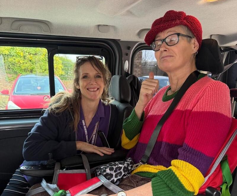 one of our female residents and activities coordinator sat in the minibus on the way to the physiotherapist