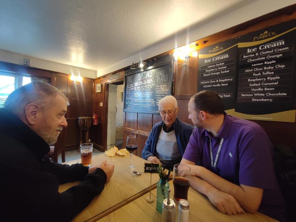 men sat around a table